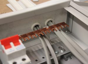 Fire rated linings for sealing cable entries to metal consumer units